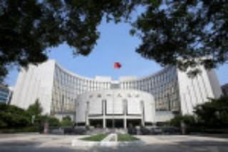 China central bank vows to push real lending rates lower