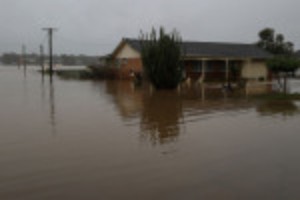 Picture of Thousands of Sydney residents return home to assess damage as flood waters recede