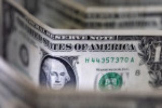 Dollar towering, stocks cowering as Fed flags more hikes