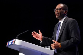 UK's Kwarteng, seeking to calm markets, brings forward budget date