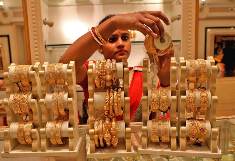 Gold rises on bargain hunting after hitting weakest level since December