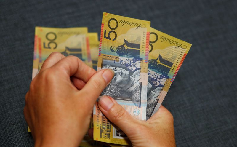 Australia's central bank says closer to normalising rates, hints at 2.5-3.5% range