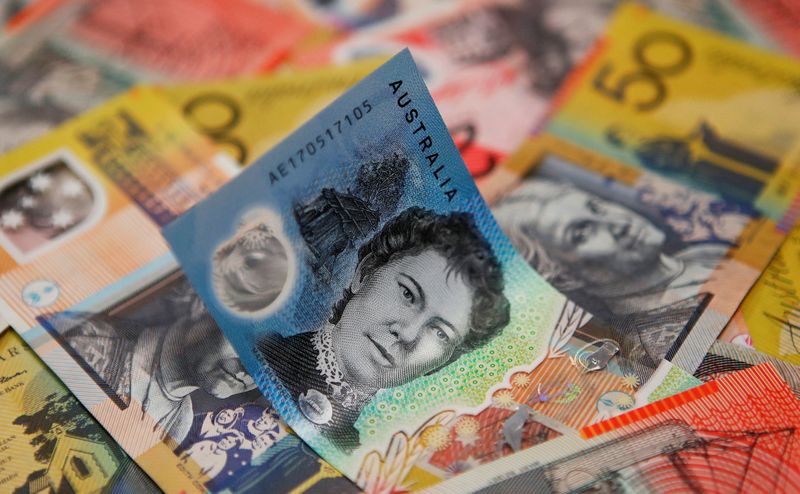 Australia, NZ dlrs hit new lows as traders buy dollars amid volatility