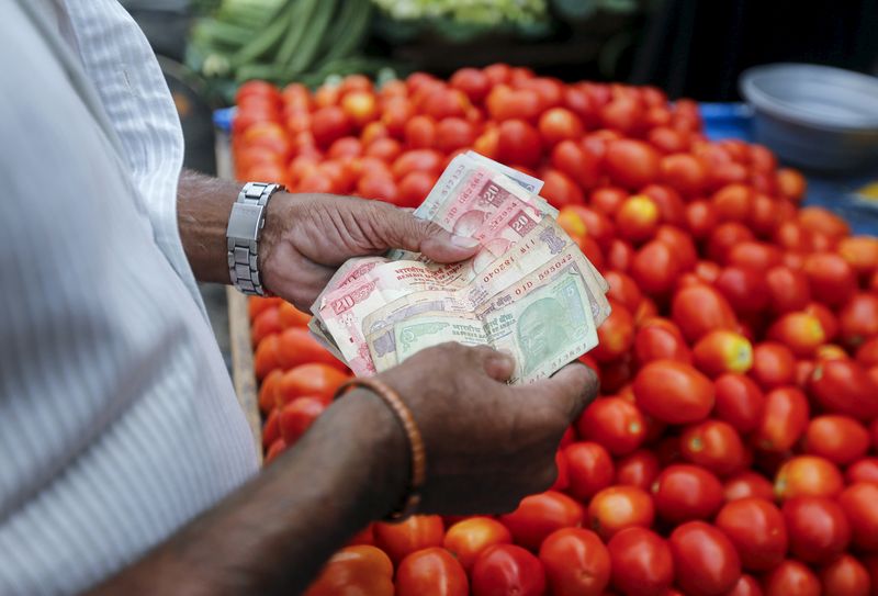 India's RBI sells dollars as rupee hits record low on U.S. rate hike fears