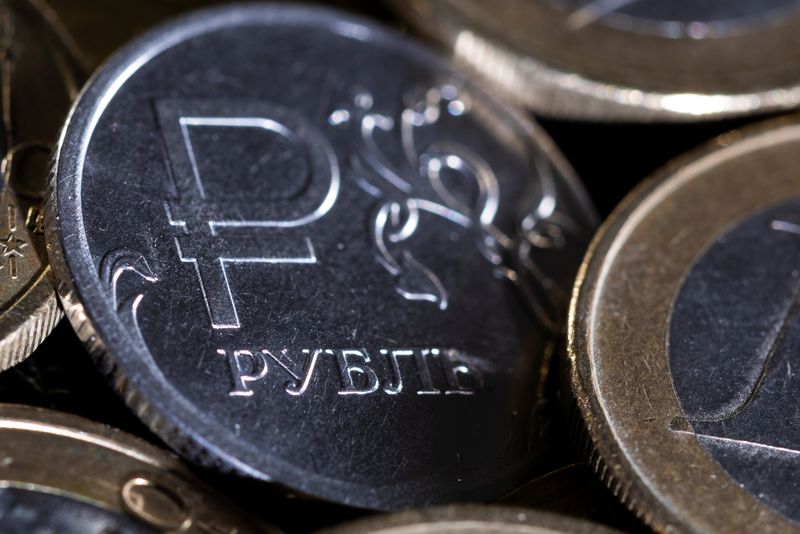 Russian rouble firms near 60 vs dollar as tax period nears