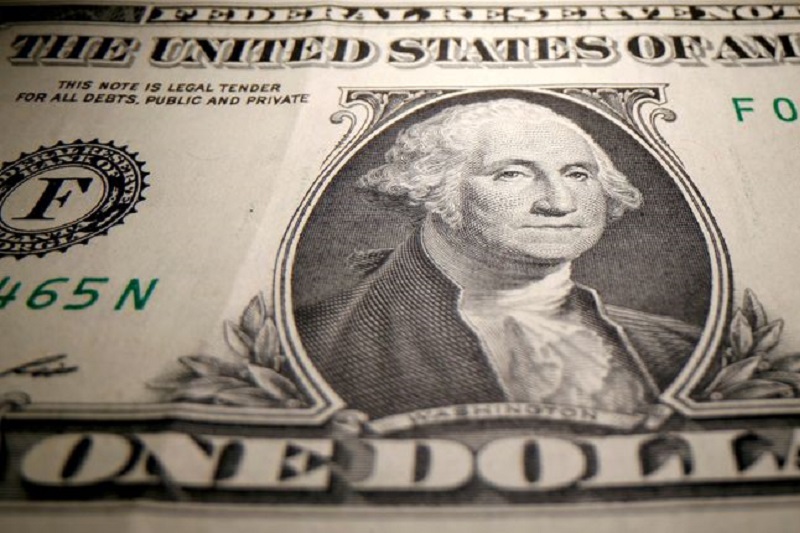 Dollar edges lower; weekly loss looms on dovish Fed