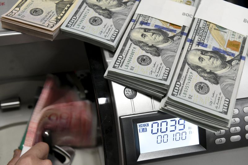 Dollar edges up at start of new year but sentiment frail