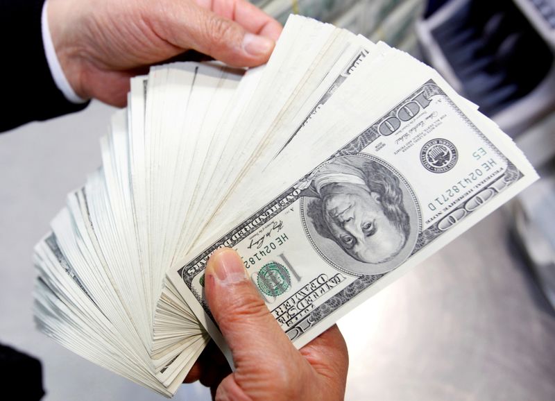 Dollar set for best month in 4-1/2 years, payrolls test looms