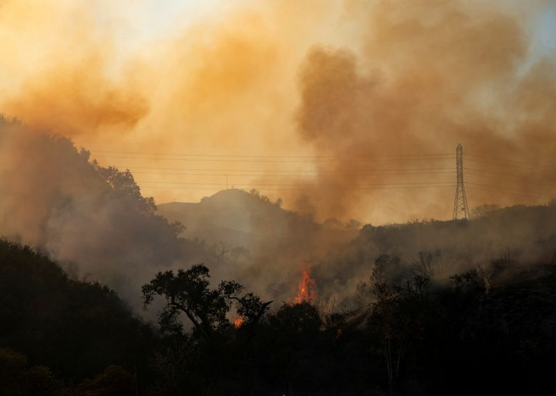 Biden ups firefighter pay, pushes climate spending as U.S. braces for wildfires